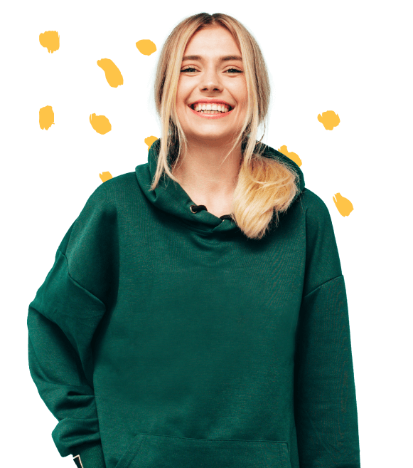 Annie, the blonde, dressed in a green hoodie with a smile on her face